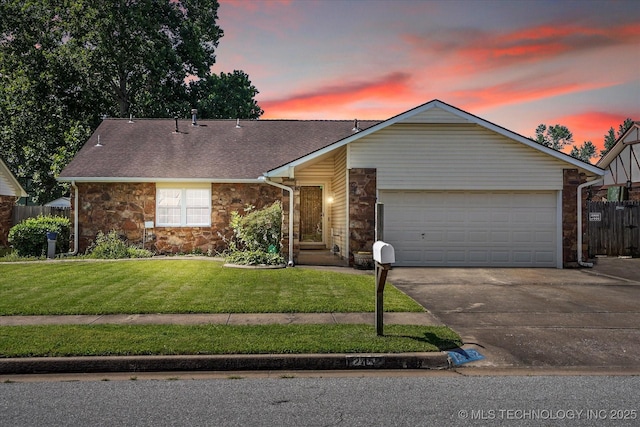 12452 E 36th St, Tulsa, OK 74146 - view of front of house with stone siding, driveway, a garage, and roof with shingles