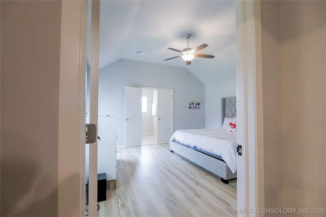9516 E 131st Pl S, Bixby, OK 74008 - bedroom featuring light wood-style floors, vaulted ceiling, and ceiling fan