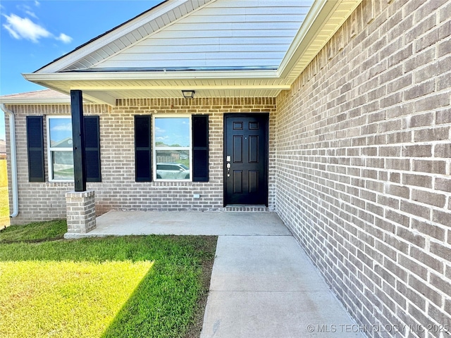 8314 E 162nd St S, Bixby, OK 74008 - entrance to property featuring brick siding and a lawn