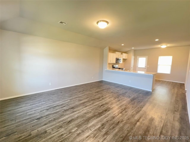 8314 E 162nd St S, Bixby, OK 74008 - unfurnished living room with dark wood-style floors and recessed lighting