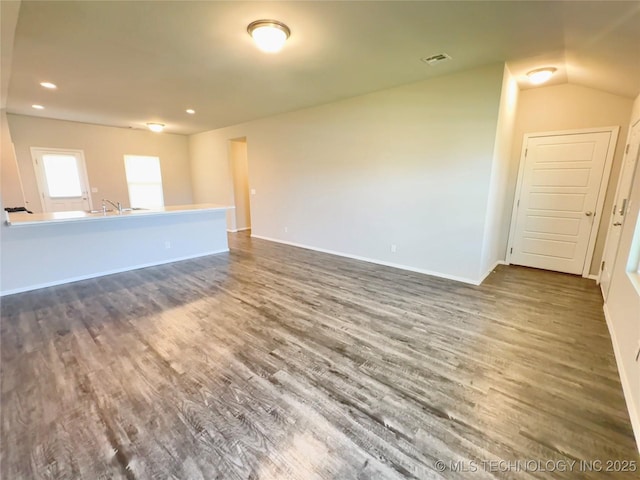 8314 E 162nd St S, Bixby, OK 74008 - unfurnished living room featuring dark wood finished floors, recessed lighting, and lofted ceiling