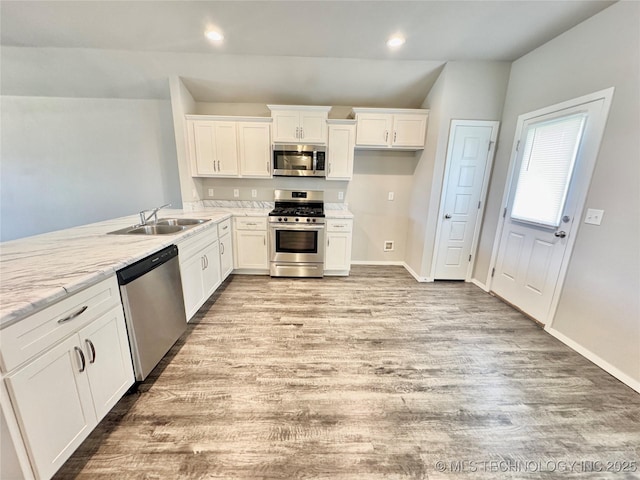 8314 E 162nd St S, Bixby, OK 74008 - kitchen featuring stainless steel appliances, light wood finished floors, white cabinetry, recessed lighting, and light stone countertops
