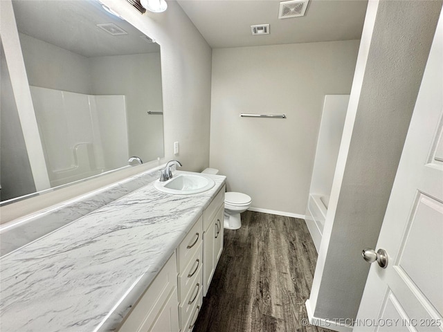 8314 E 162nd St S, Bixby, OK 74008 - bathroom featuring vanity, wood finished floors, and bathtub / shower combination