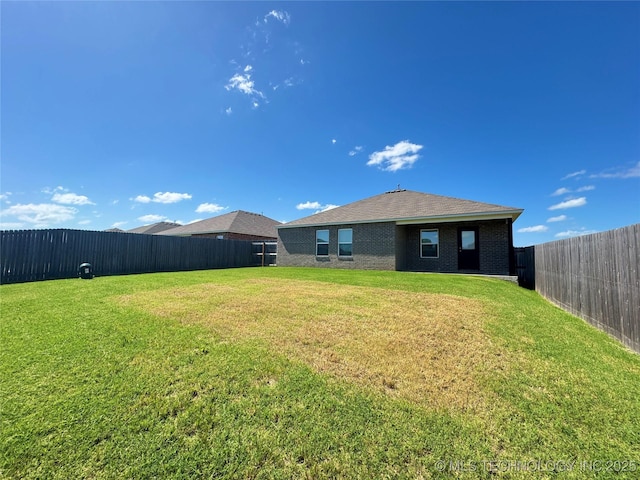 8314 E 162nd St S, Bixby, OK 74008 - back of house with a fenced backyard and brick siding
