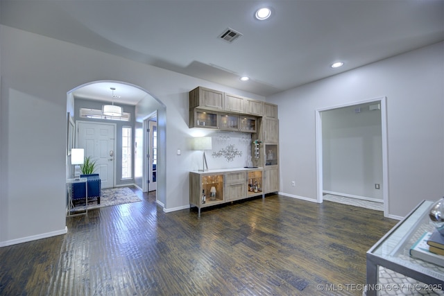 124 W 125th Ct S, Jenks, OK 74037 - kitchen featuring arched walkways, dark wood-style floors, recessed lighting, and backsplash