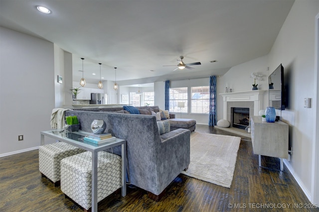 124 W 125th Ct S, Jenks, OK 74037 - living area with ceiling fan, dark wood-style floors, a tiled fireplace, and recessed lighting