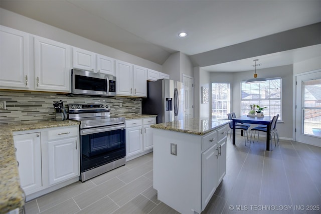 124 W 125th Ct S, Jenks, OK 74037 - kitchen with appliances with stainless steel finishes, backsplash, white cabinets, a center island, and light stone countertops