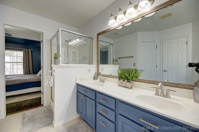 124 W 125th Ct S, Jenks, OK 74037 - bathroom featuring double vanity, tile patterned floors, a stall shower, and connected bathroom