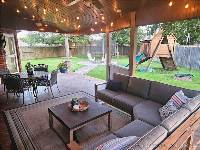 124 W 125th Ct S, Jenks, OK 74037 - fenced backyard featuring a trampoline, a playground, an outdoor hangout area, a patio area, and outdoor dining space