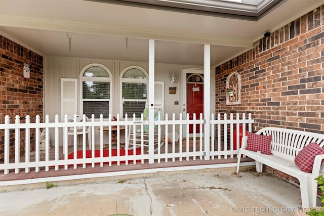 11837 E 61st Pl, Broken Arrow, OK 74012 - doorway to property featuring brick siding and covered porch