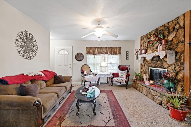11837 E 61st Pl, Broken Arrow, OK 74012 - carpeted living room with a ceiling fan and a fireplace