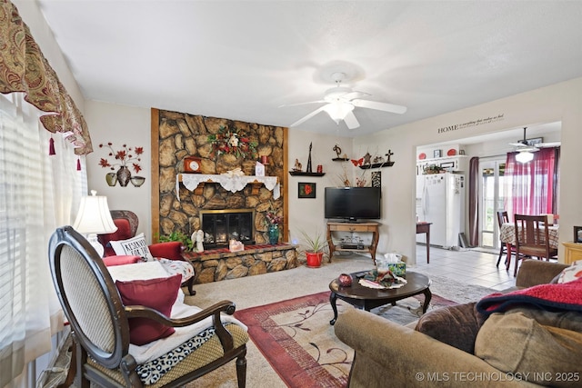 11837 E 61st Pl, Broken Arrow, OK 74012 - living area with a ceiling fan, a stone fireplace, and carpet flooring