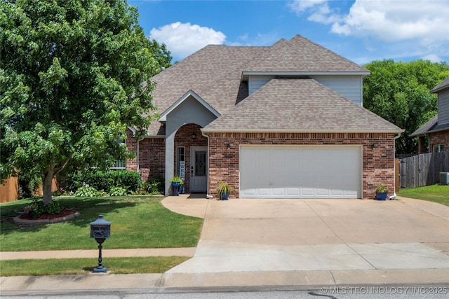 2611 S 15th Pl, Broken Arrow, OK 74012 - traditional-style home featuring a shingled roof, driveway, an attached garage, and brick siding