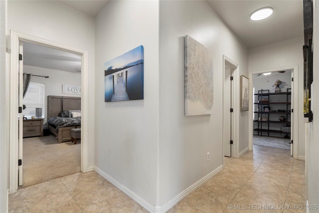 2611 S 15th Pl, Broken Arrow, OK 74012 - hallway featuring light tile patterned floors and baseboards