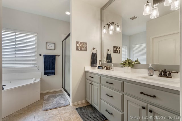 2611 S 15th Pl, Broken Arrow, OK 74012 - full bathroom with double vanity, a garden tub, a stall shower, and tile patterned flooring