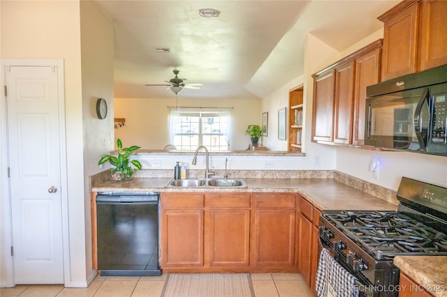 1330 Panther Ln, Sapulpa, OK 74066 - kitchen with black appliances, light tile patterned flooring, a ceiling fan, brown cabinets, and light countertops