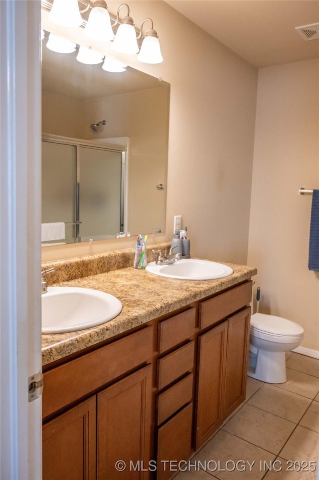 1330 Panther Ln, Sapulpa, OK 74066 - bathroom with double vanity, a shower stall, and tile patterned flooring