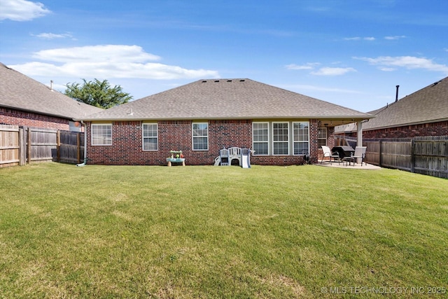 1801 E Montgomery St, Broken Arrow, OK 74012 - back of property with brick siding, a fenced backyard, a patio area, and a shingled roof