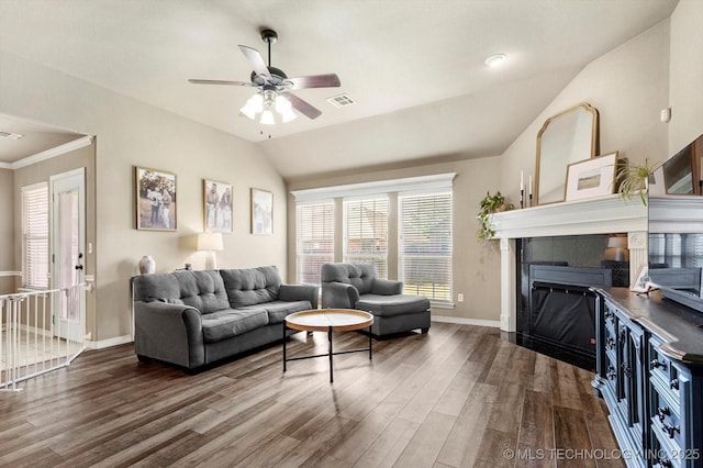 1801 E Montgomery St, Broken Arrow, OK 74012 - living area with wood finished floors, vaulted ceiling, ceiling fan, and a fireplace