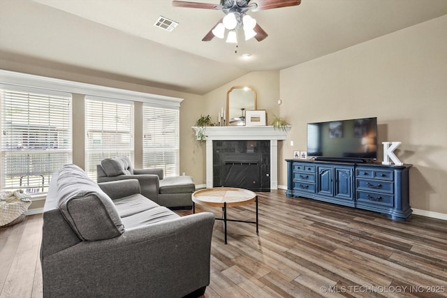 1801 E Montgomery St, Broken Arrow, OK 74012 - living room featuring ceiling fan, wood finished floors, lofted ceiling, and healthy amount of natural light