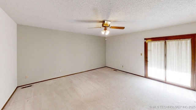 1124 Surrey Dr, Ardmore, OK 73401 - spare room with a ceiling fan, carpet floors, and a textured ceiling