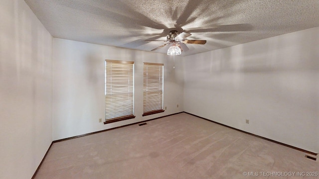 1124 Surrey Dr, Ardmore, OK 73401 - empty room with ceiling fan, carpet, and a textured ceiling