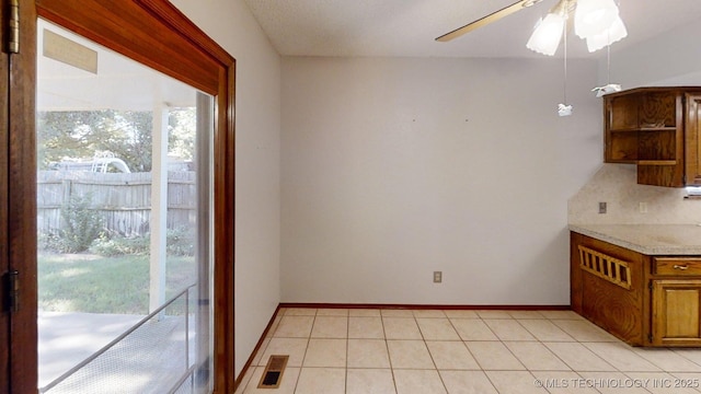 1124 Surrey Dr, Ardmore, OK 73401 - unfurnished dining area featuring ceiling fan and light tile patterned floors