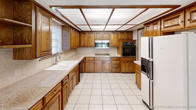 1124 Surrey Dr, Ardmore, OK 73401 - kitchen with black appliances, open shelves, brown cabinetry, backsplash, and plenty of natural light