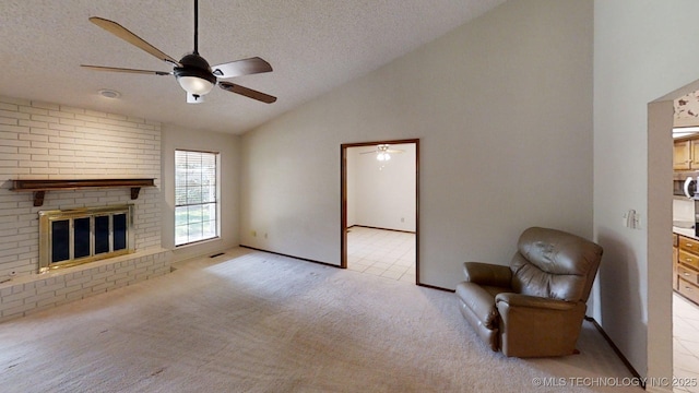 1124 Surrey Dr, Ardmore, OK 73401 - unfurnished living room with lofted ceiling, a ceiling fan, light carpet, a textured ceiling, and a fireplace