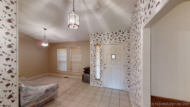 1124 Surrey Dr, Ardmore, OK 73401 - entryway featuring light tile patterned floors and wallpapered walls