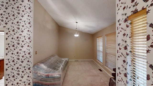 1124 Surrey Dr, Ardmore, OK 73401 - unfurnished room featuring vaulted ceiling and baseboards