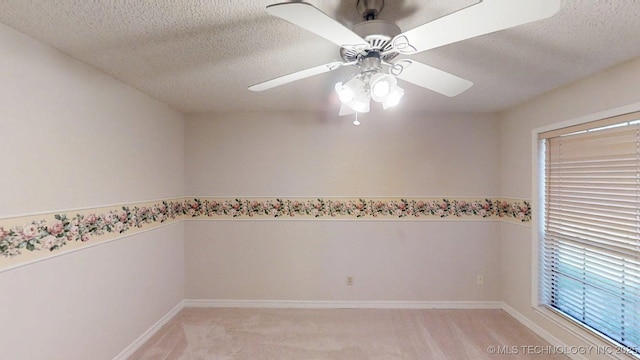 1124 Surrey Dr, Ardmore, OK 73401 - spare room with a textured ceiling, light colored carpet, and a ceiling fan