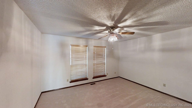 1124 Surrey Dr, Ardmore, OK 73401 - unfurnished room featuring ceiling fan, a textured ceiling, and light colored carpet
