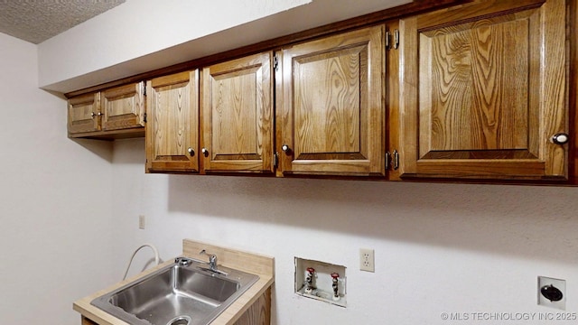 1124 Surrey Dr, Ardmore, OK 73401 - laundry area with cabinet space, hookup for an electric dryer, and washer hookup
