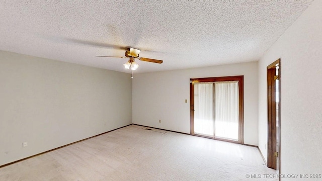 1124 Surrey Dr, Ardmore, OK 73401 - spare room featuring light carpet and a ceiling fan
