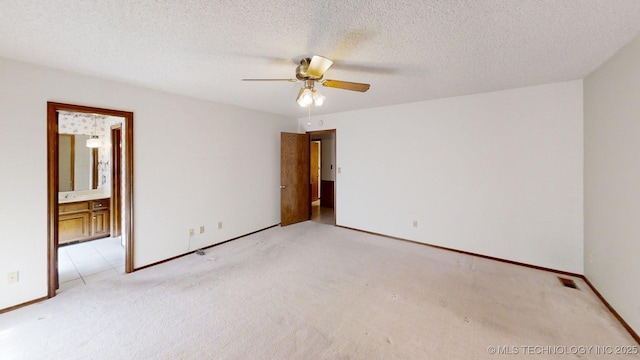 1124 Surrey Dr, Ardmore, OK 73401 - spare room featuring light carpet and a ceiling fan