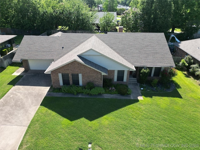 1124 Surrey Dr, Ardmore, OK 73401 - view of front of property with brick siding, a front yard, driveway, a chimney, and a shingled roof