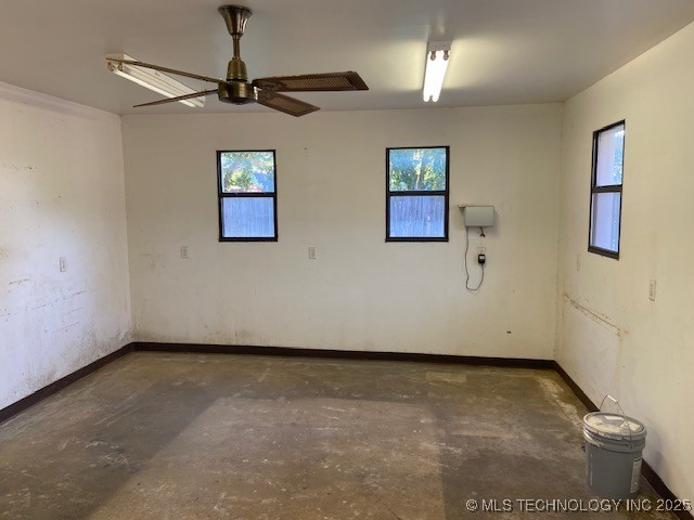 1124 Surrey Dr, Ardmore, OK 73401 - unfurnished room featuring concrete flooring and ceiling fan