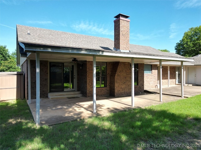 1124 Surrey Dr, Ardmore, OK 73401 - back of property featuring a chimney, brick siding, a patio, and a ceiling fan