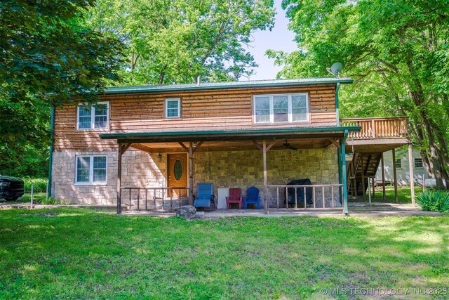 9596 N 447th Rd, Spavinaw, OK 74366 - back of property with a patio area, stairway, a lawn, and stone siding