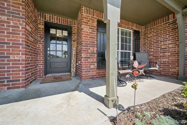 921 S 75th St, Broken Arrow, OK 74014 - view of exterior entry with covered porch and brick siding