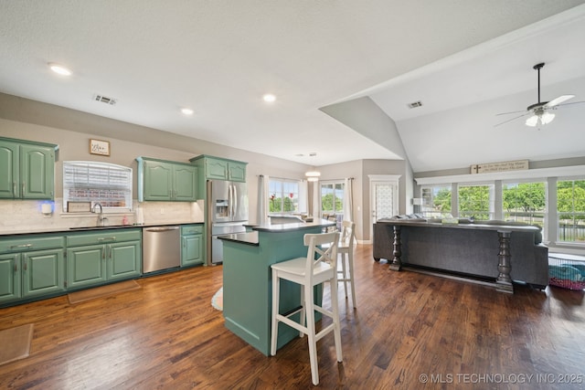 921 S 75th St, Broken Arrow, OK 74014 - kitchen featuring stainless steel appliances, green cabinetry, open floor plan, ceiling fan, and recessed lighting