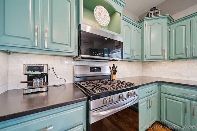 921 S 75th St, Broken Arrow, OK 74014 - kitchen with appliances with stainless steel finishes, dark countertops, and decorative backsplash
