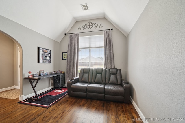 921 S 75th St, Broken Arrow, OK 74014 - sitting room with wood finished floors, arched walkways, and vaulted ceiling