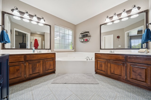 921 S 75th St, Broken Arrow, OK 74014 - bathroom with two vanities and a bath