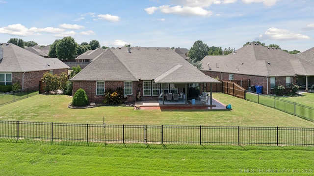 921 S 75th St, Broken Arrow, OK 74014 - rear view of house with brick siding, a patio area, a fenced backyard, and roof with shingles