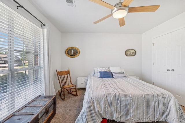 14907 E 88th St N, Owasso, OK 74055 - bedroom featuring carpet floors, ceiling fan, and a closet
