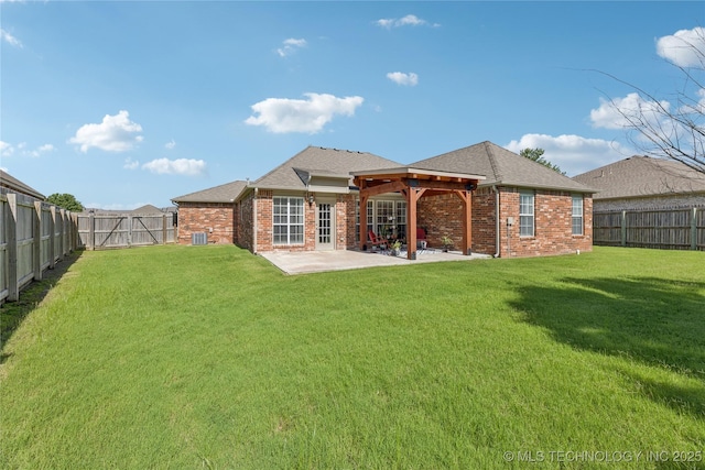 14907 E 88th St N, Owasso, OK 74055 - back of house with brick siding, a patio area, a fenced backyard, and a shingled roof