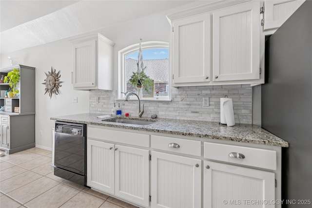 14907 E 88th St N, Owasso, OK 74055 - kitchen with black dishwasher, decorative backsplash, light tile patterned floors, and white cabinets