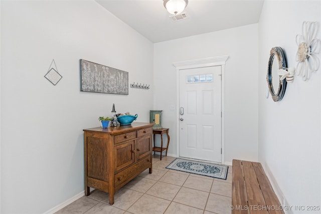 14907 E 88th St N, Owasso, OK 74055 - foyer entrance featuring light tile patterned floors and baseboards